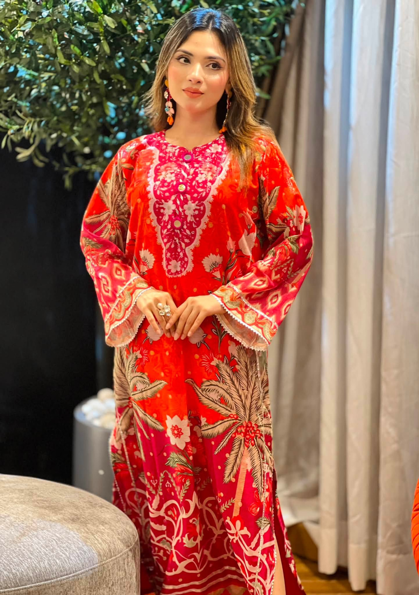 Model wearing a crimson printed kaftan dress